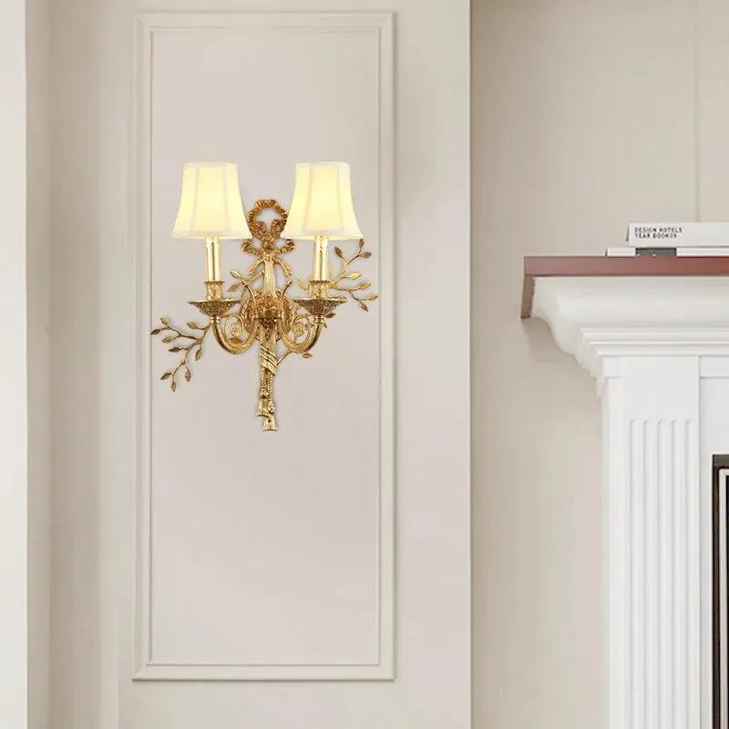 Elegant Handcrafted Brass Wall Sconce Adds Regal Charm to Your Bedroom Decor.